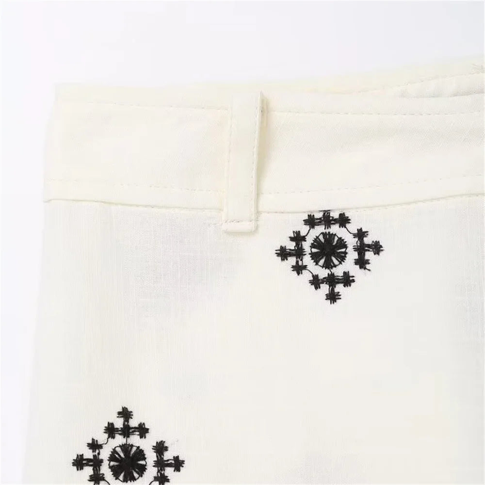 Pantalón retro ancho bordado con flores minimalistas